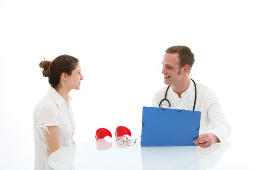 Smiling doctor and his patient are sitting at the table on white background