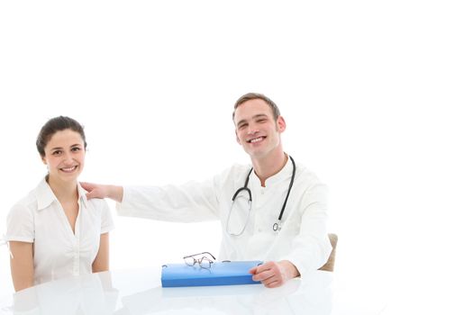 Young doctor with a folio of the patient's records sitting at a table in consultation with a female patient