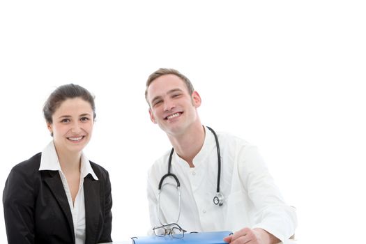 Successful young medical team of a smiling young male doctor sitting beside a female consultant or specialist physician