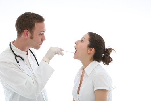 Young doctor examines throat of his patient on white background