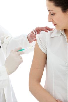 Female patient receiving an intramuscular injection in her upper arm isolated on white