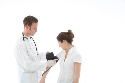 Doctor applying a blood pressure cuff to the arm of a female patient in order to measure her blood pressure