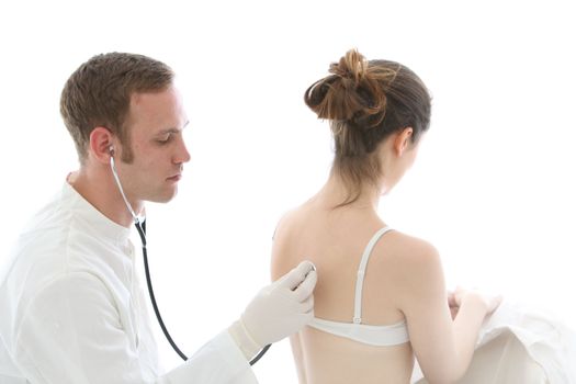 Doctor listening to the heart and lungs using a stethoscope on the back of a seated female patient wearing a bra