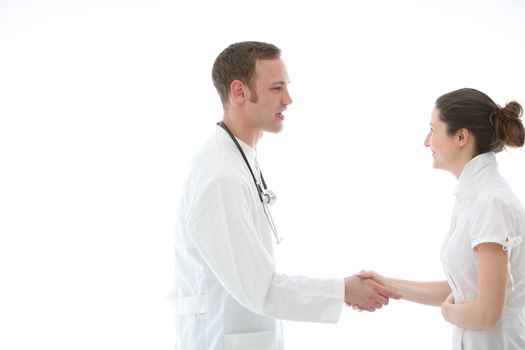 Doctor shaking a colleague's hand in greeting or congratulations at a successful outcome