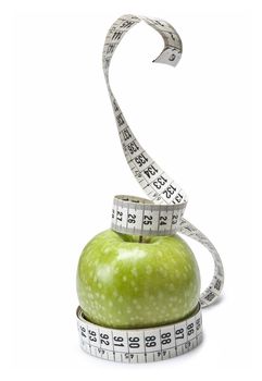 Tape measure simulating a snake wrapped around an apple.