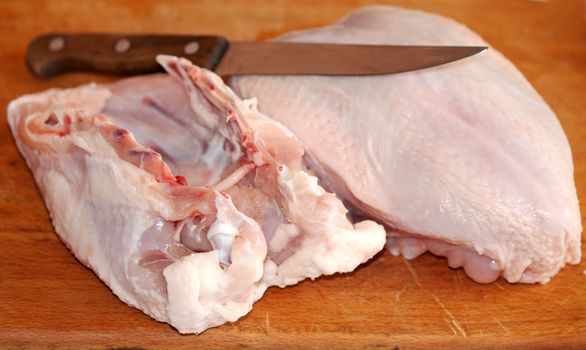 Chicken breast and a knife