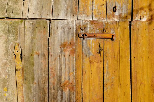 Rural background of an old farm building door.