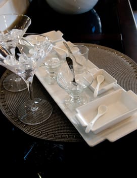 Martini service dishes on a woven place mat.