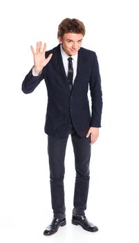 Teenage boy in a business suit. Isolated on white background.