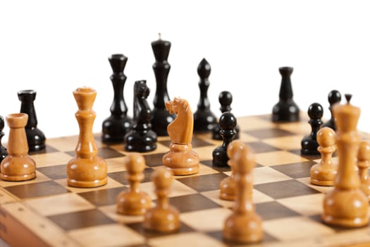 Strategy and competition chess game figures on wood board