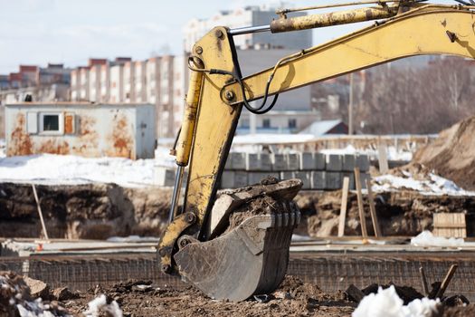 Earth digging machine scoop equipment at building construction site