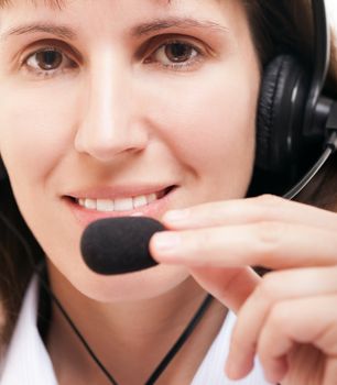 Beauty smiling business woman with headphones or headset