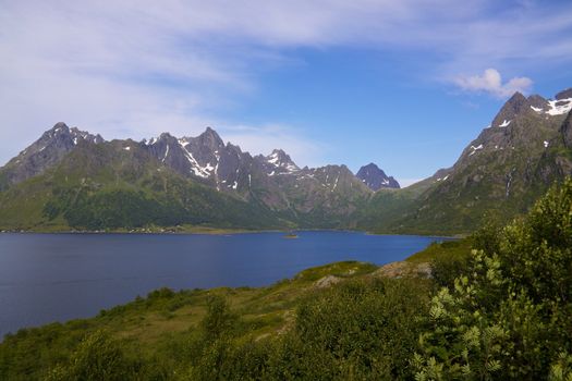 Picturesque scenery on Lofoten Islands with fjord and steep rocky mountains