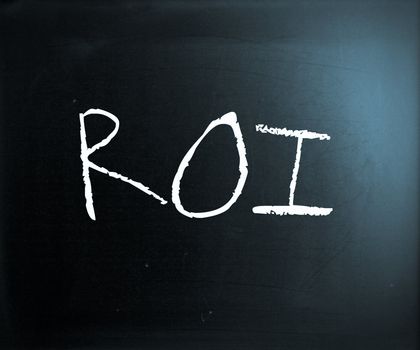 "ROI" handwritten with white chalk on a blackboard.