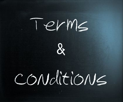 "Terms & Conditions" handwritten with white chalk on a blackboard.