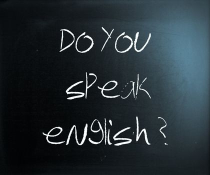 "Do you speak english" handwritten with white chalk on a blackboard.