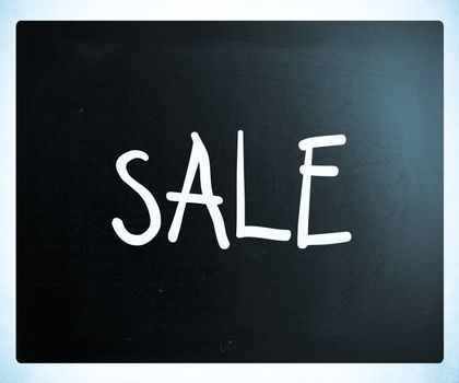 "Sale" handwritten with white chalk on a blackboard
