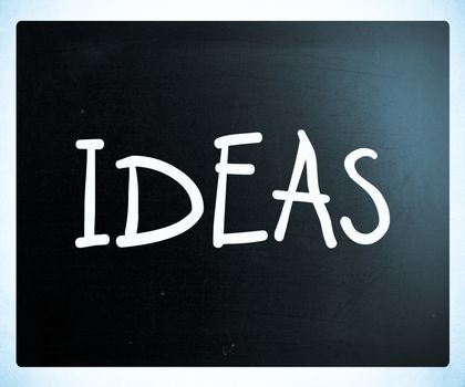 "Ideas" handwritten with white chalk on a blackboard
