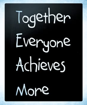 TEAM acronym white chalk handwriting on blackboard