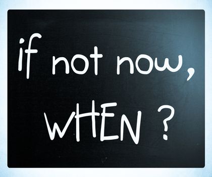 "If not now, when?" handwritten with white chalk on a blackboard