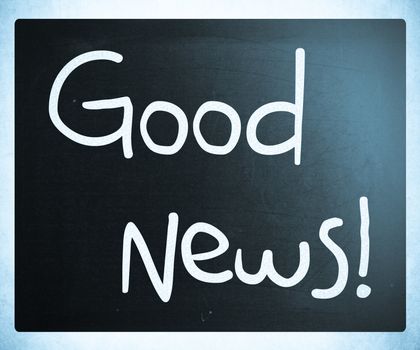 "Good News!" handwritten with white chalk on a blackboard