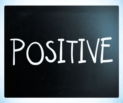 "Positive" handwritten with white chalk on a blackboard