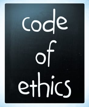 "Code of ethics" handwritten with white chalk on a blackboard