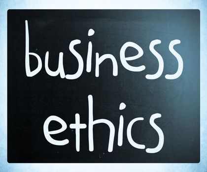 "Business Ethics" handwritten with white chalk on a blackboard