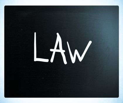 "Law" handwritten with white chalk on a blackboard