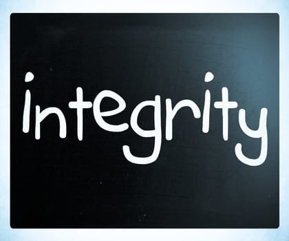 "Integrity" handwritten with white chalk on a blackboard