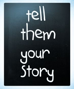 "Tell them your story" handwritten with white chalk on a blackboard