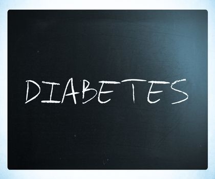 The word "Diabetes" handwritten with white chalk on a blackboard.