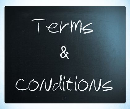 "Terms & Conditions" handwritten with white chalk on a blackboard.