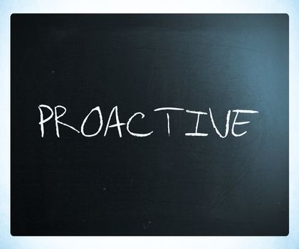 The word 'Proactive' handwritten with white chalk on a blackboard.