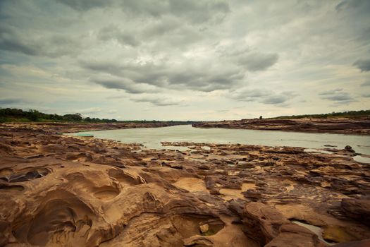 Sampanbok (3000 Hole), The Amazing of Rock in Mekong River, Ubon Ratchathani, Thailand.