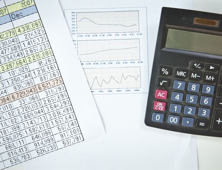 Graphs, charts, business table. The workplace of business people.