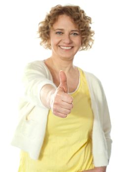 Glamorous woman gesturing thumbs-up isolated on white