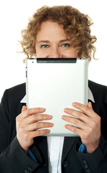 Corporate lady hiding her face with tablet device