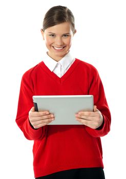 School girl holding tablet computer isolated on white background