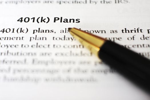 A pen draws attention to the words "401(k) Plans" 