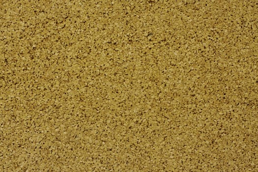 A horizontal close up of cork board showing texture detail, background 