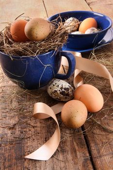 Easter eggs in enamel cup with ribbons