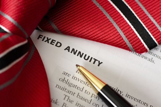 Pen and tie draw attention to the words "fixed annuity"