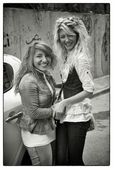 TWO HAPPY GIRLS, ISTANBUL, TURKEY, APRIL 17, 2012: Two smiling young turkish girls in the street  asking for being captured