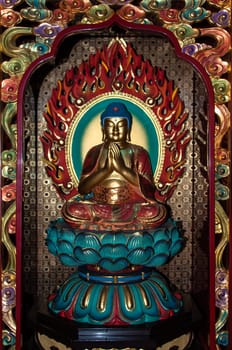 Chinese Buddha statue in Chinese Buddhism temple in Singapore