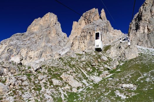 summer view of Sassolungo mountain with the characteristic cableway, Trentino, Italy
