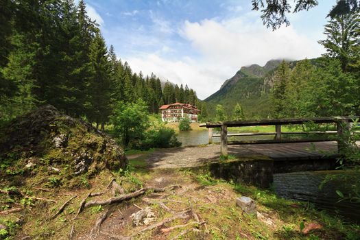 small lake with bridge in San Martino di Castrozza, Trentino, Italy