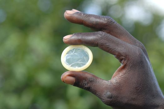 condom in the hands of an African