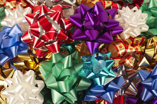 A pile of multi-colored bows to put on gift wrapped presents