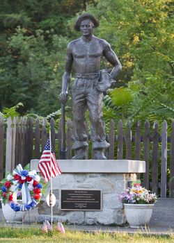 NEW CASTLE, PA / USA – AUGUST 11, 2011: This memorial depicts the Civilian Conservation Corps. Cascade Park is one of over 800 parks created by the Civilian Conservation Corps. CCC was designed by Roosevelt to create unskilled labor jobs between 1933 and 1942. 